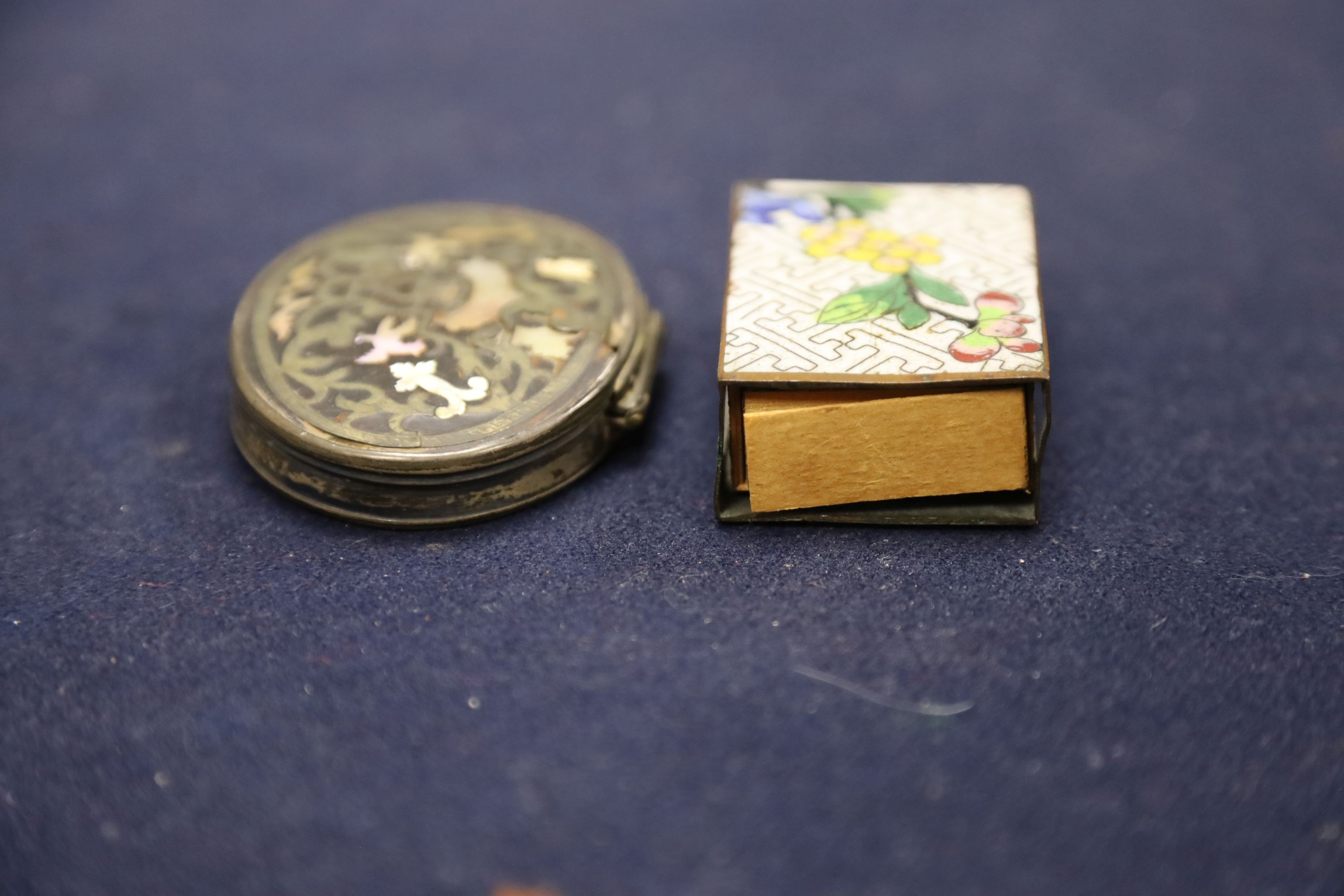 A Chinese small celadon jadeite lion on stand, a small jade circular plaque on stand (damage) and sundry items